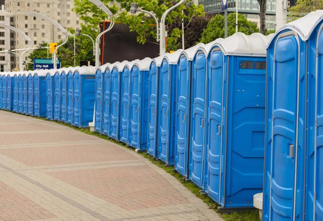 a row of portable restrooms at a fairground, offering visitors a clean and hassle-free experience in Castanea PA